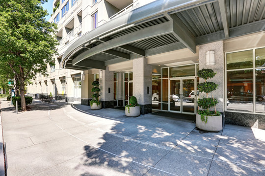 Apartment Building Exterior. View Of Entrance