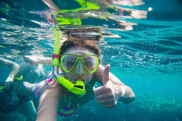 girl engaged in snorkeling  - 119133785