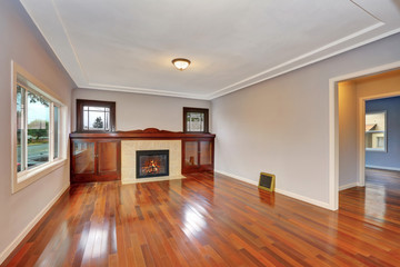Empty living room interior with polished hardwood floor