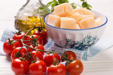 cheese , cherry tomatoes,oil and fresh parsley- ingredients for  salad