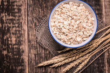 oat flakes on wooden table.healthy food concept.