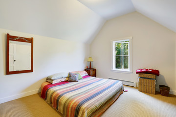 Simple design of attic bedroom with vaulted ceiling