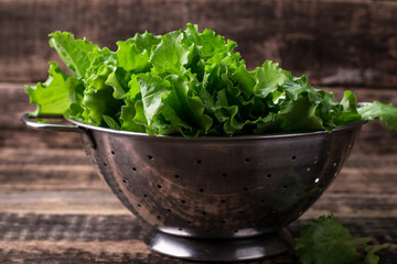 lettuce leaves on wooden table, healthy food