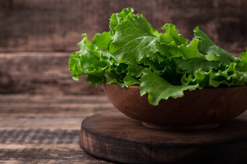 lettuce leaves on wooden table, healthy food