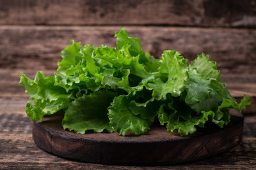 lettuce leaves on wooden table, healthy food
