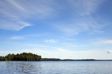 Landscape from Finland. An image of a scenery by the lake on a sunny summer day.