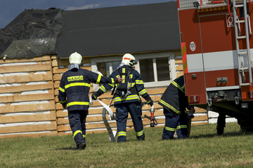 Firefighters extinguish fire fire vehicle