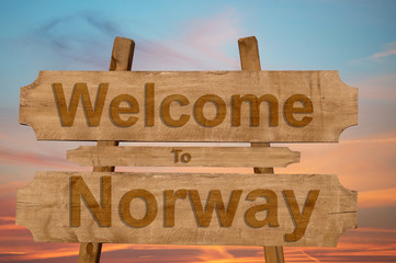 Welcome to Norway sign on wood background