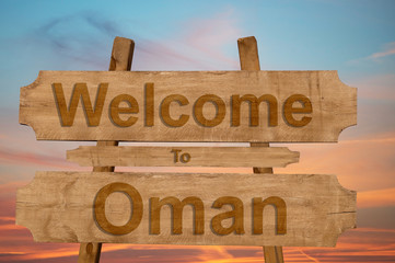 Welcome to Oman sign on wood background