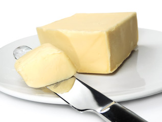 Fresh piece of butter, studio shot, unhealthy eating.