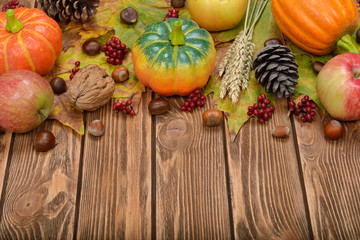 Autumn leaves, apples, pumpkins and nuts