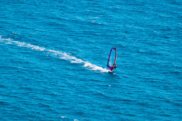 Surfer windsurfing on sea