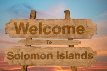 Welcome to Solomon Islands sign on wood background