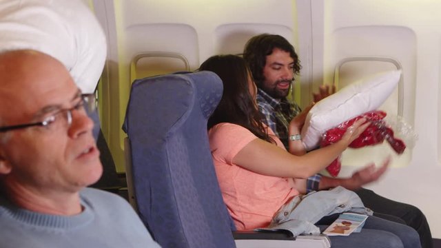 Passengers on plane receive blanket and pillow