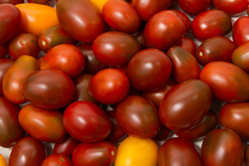 Pile of ripe tomatoes (Cherry, Black Prince)