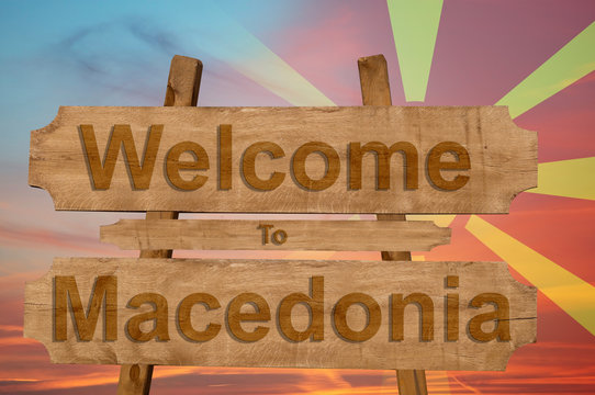 Welcome to Macedonia sign on wood background with blending nationa