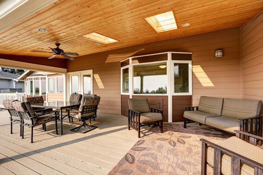 Large Wooden Walkout Deck With Flat Roof Extension