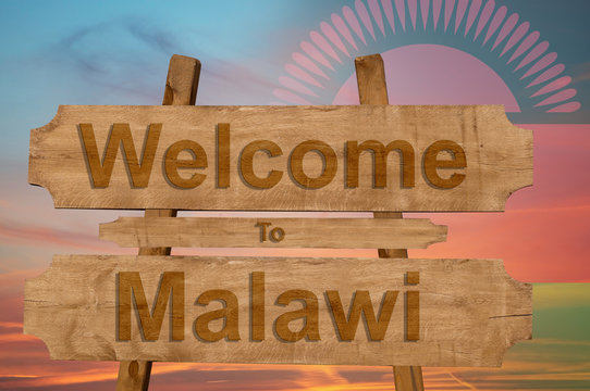 Welcome to Malawi sign on wood background with blending nationa