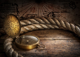 Magnetic old compass on world map.Travel, geography, navigation, tourism and exploration concept...