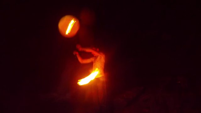 Male With Naked Torso in the Darkness Doing Fire Show