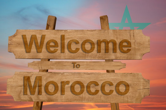 Welcome to Morocco sign on wood background with blending nationa flag
