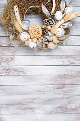 Christmas wreath on wooden background. Space for text.