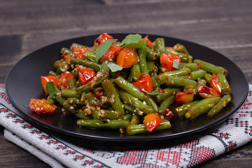 Healthy green beans, red cherry tomato with sesame seeds