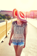 Young woman walking on margaret bridge budapest in sunset