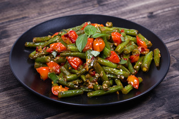 Healthy green beans, red cherry tomato with sesame seeds