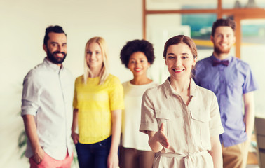 woman making handshake over creative office team