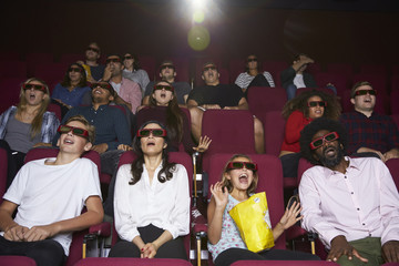 Obraz premium Audience In Cinema Wearing 3D Glasses Watching Horror Film