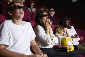 Naklejka premium Audience In Cinema Wearing 3D Glasses Watching Horror Film