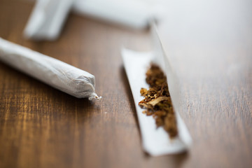 close up of marijuana joint and tobacco