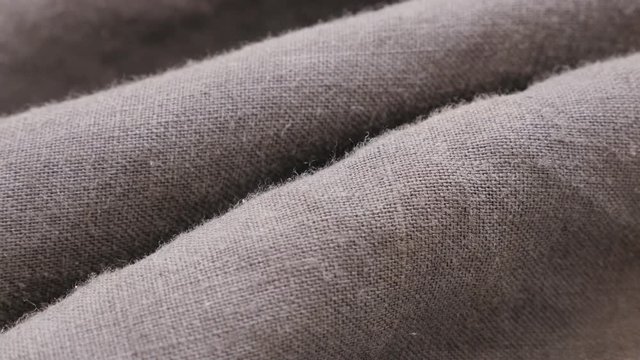 Dark linen fabric of flax plant made for clothes close-up details 4K 2160p 30fps UltraHD tilting footage - High quality texture of linen material slow tilt 4K 3840X2160 UHD footage 