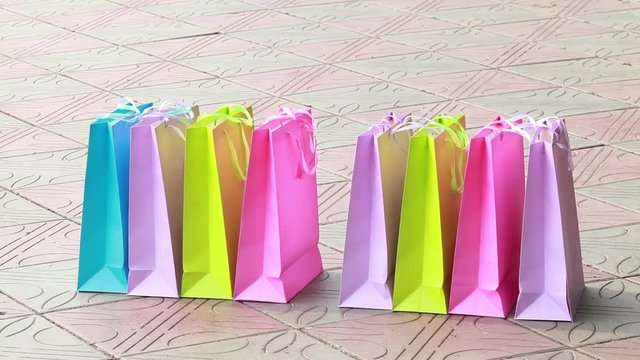 Female legs in high heels and shopping bags