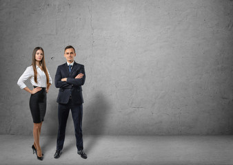 Front view of businessman and businesswoman standing