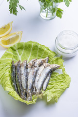 fried sardines on the plate