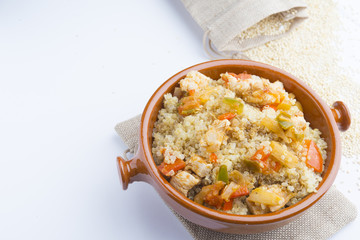 High-key image of white plate with quinoa lentil salad and bowl