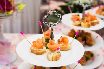 Fotobehang mini canapes with smoked salmon on table © subinpumsom