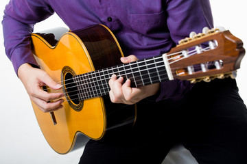 Obraz na płótnie Canvas Acoustic guitar guitarist man classical. Classic player music pl