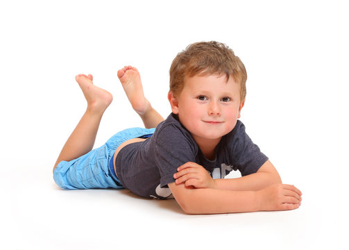 Little boy relaxing. People isolated on white background.