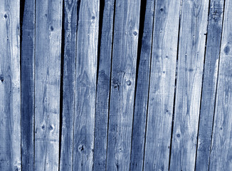 Grungy blue wooden fence texture.