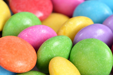 Close-up detail of pile of colored smarties texture
