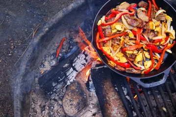 Aluminium Prints Cooking Cooking fajitas over a campfire
