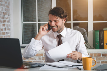 Obraz premium Smiling Young Businessman