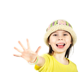 Cute little girl happily shows an open hand