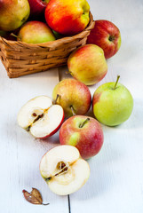 Autumn apples on a white wooden table