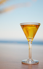 Cocktail with seafront on a background