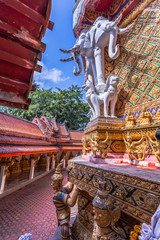 Fototapeta na wymiar Maha Chedi of wat Bangreange is located on the hilltop The Buddha statue,Giant statue and elephant sculpture .are surrounded by a round base. This temple is completely surrounded by mountains, trees.