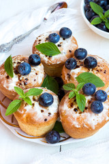 Cupcake with blueberries and mint.